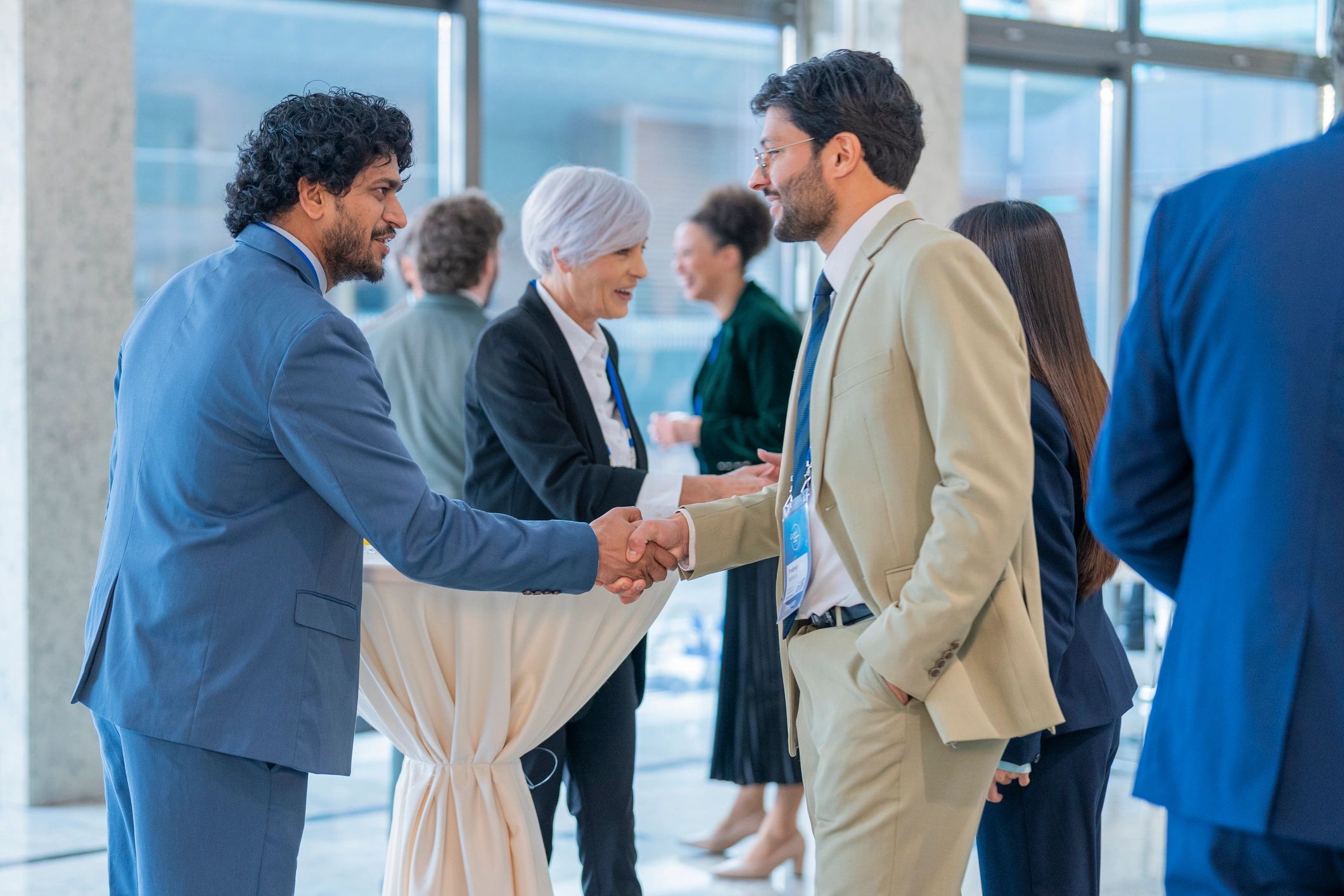 Professionals networking at a chamber-style event